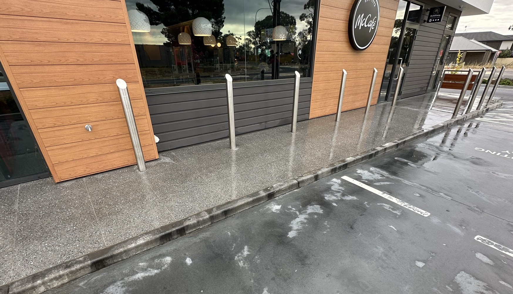 Concrete resurfacing with epoxy flooring and exterior cleaning in Adelaide.