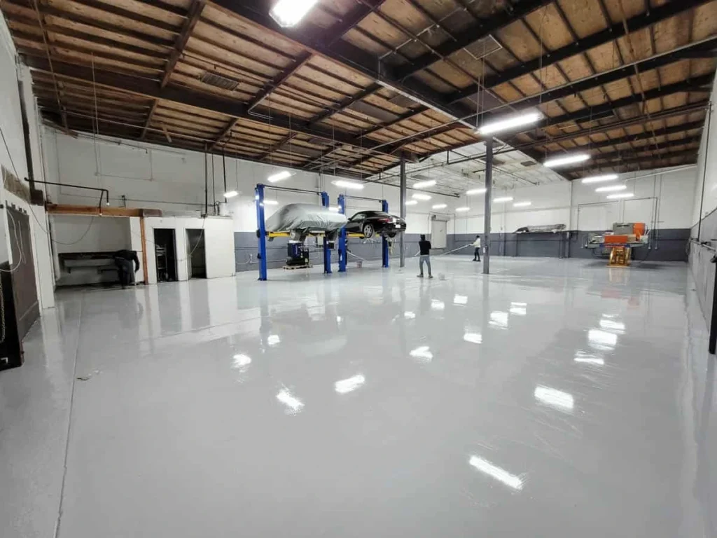 Spacious garage with freshly resurfaced shiny white flooring in Adelaide.