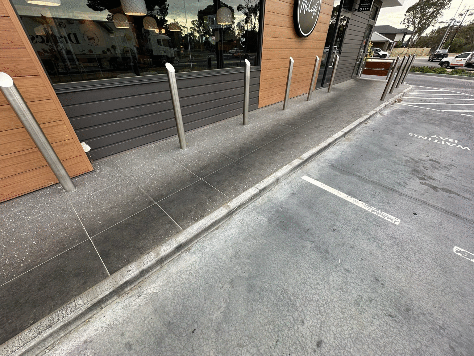 Before shot of a concrete surface showing wear before resurfacing and cleaning.