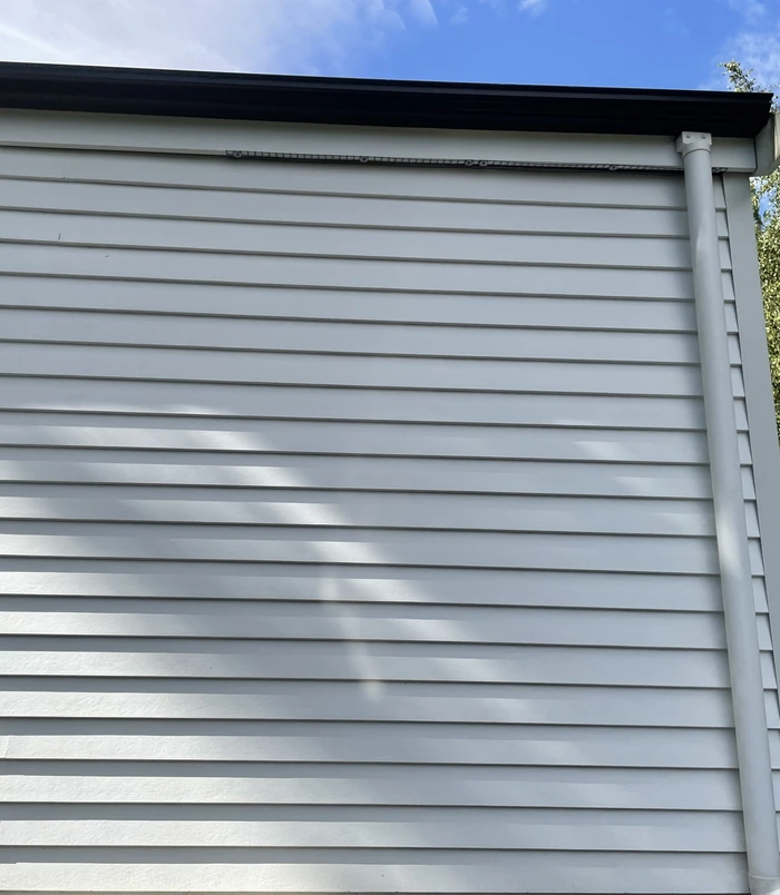 Clean, bright weatherboard cladding after pressure washing