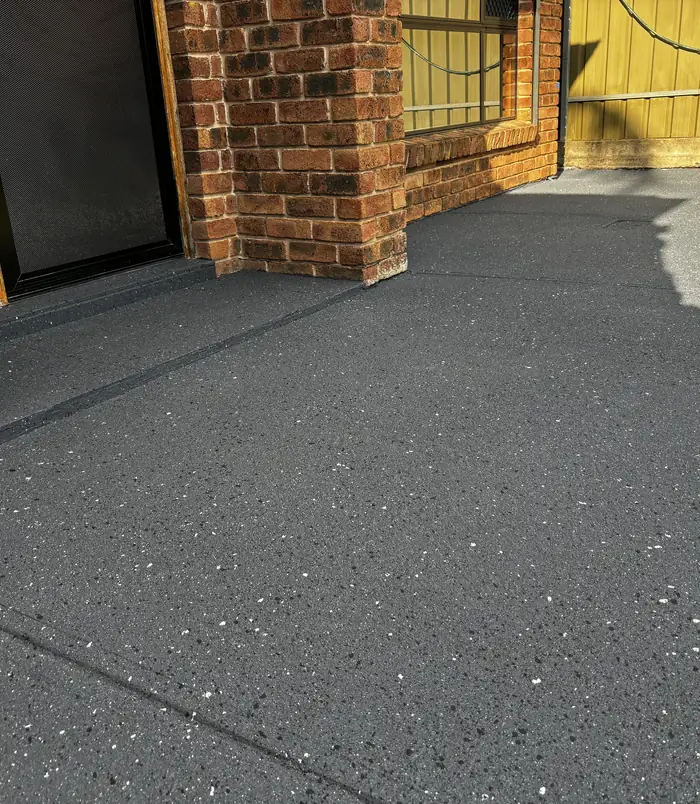 Dark grey resurfaced concrete with a smooth, even finish