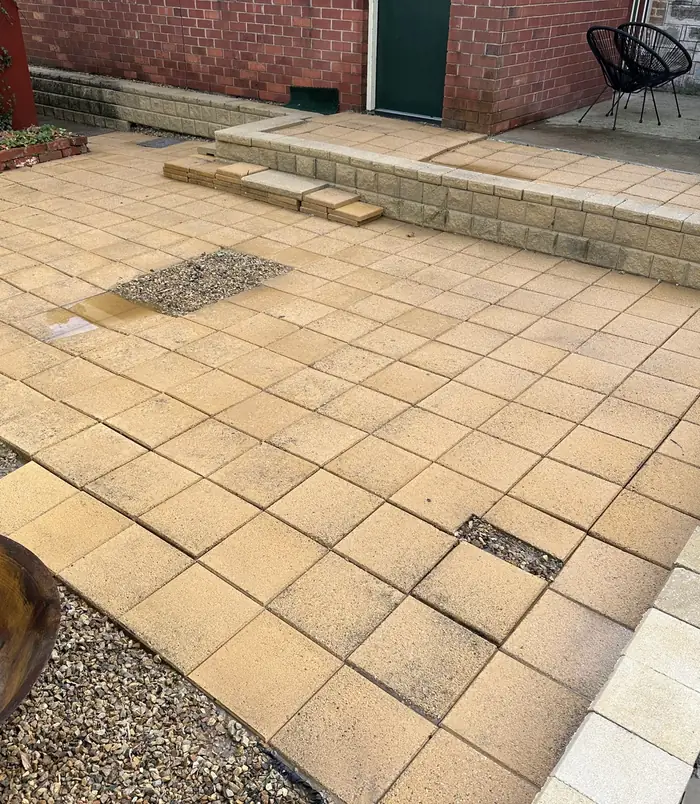 Clean, warm-toned square pavers after pressure washing