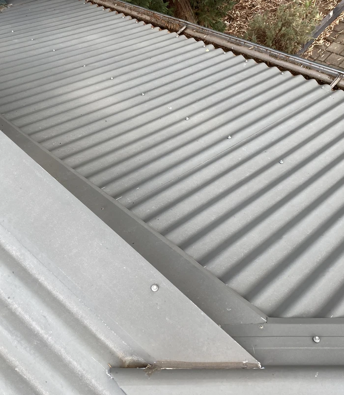 Clean, even grey corrugated roof sheeting after pressure washing
