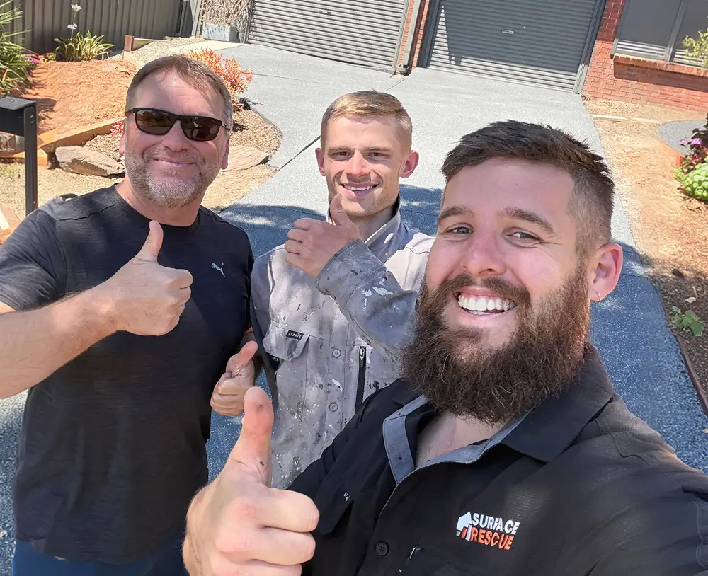 Surface rescue team members with a happy client