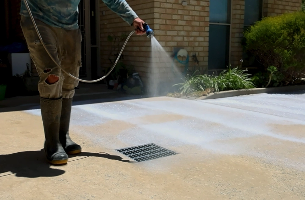 Surface Rescue technician working on a concrete driveway
